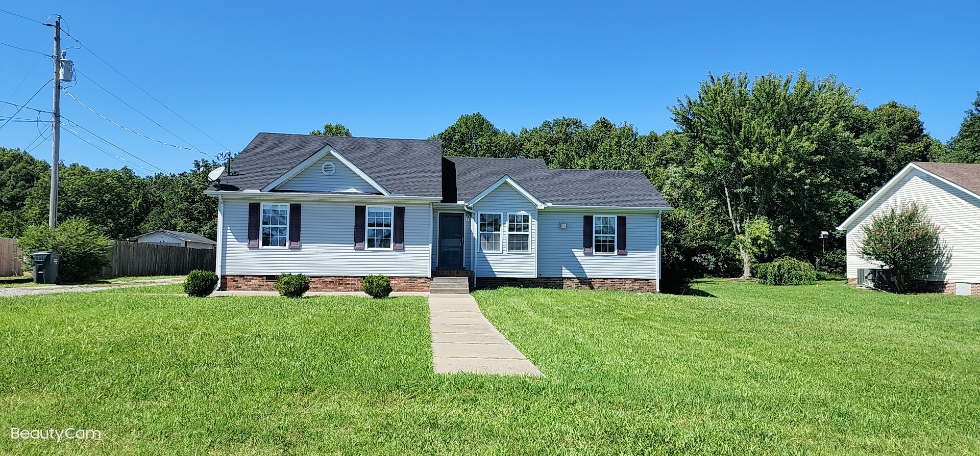 1368 Pomona Road Dickson, TN 37055 - Photo 3 of 24 a front view of a house with a yard