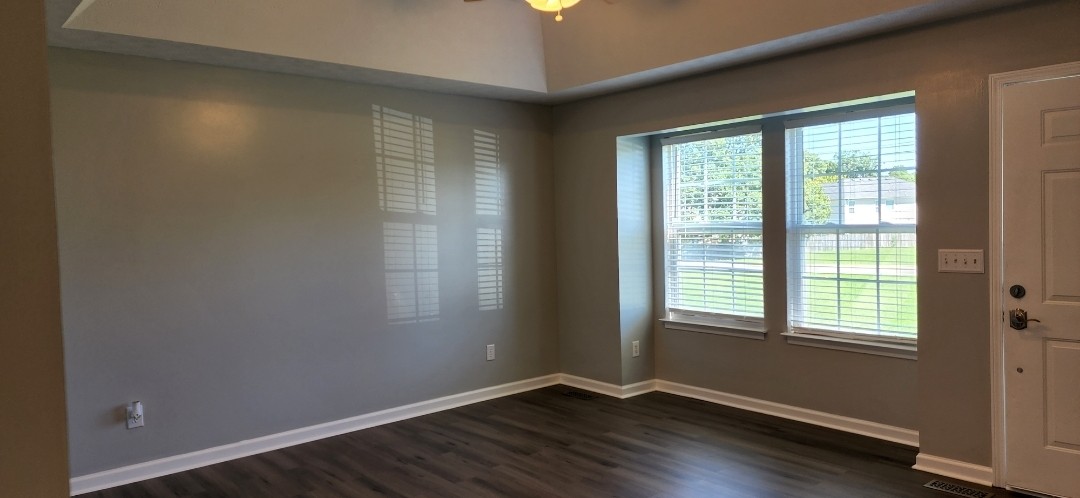 1368 Pomona Road Dickson, TN 37055 - Photo 8 of 24 a view of an empty room with wooden floor and a window
