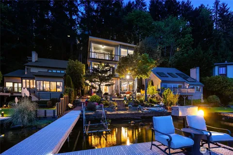 a view of swimming pool with outdoor seating