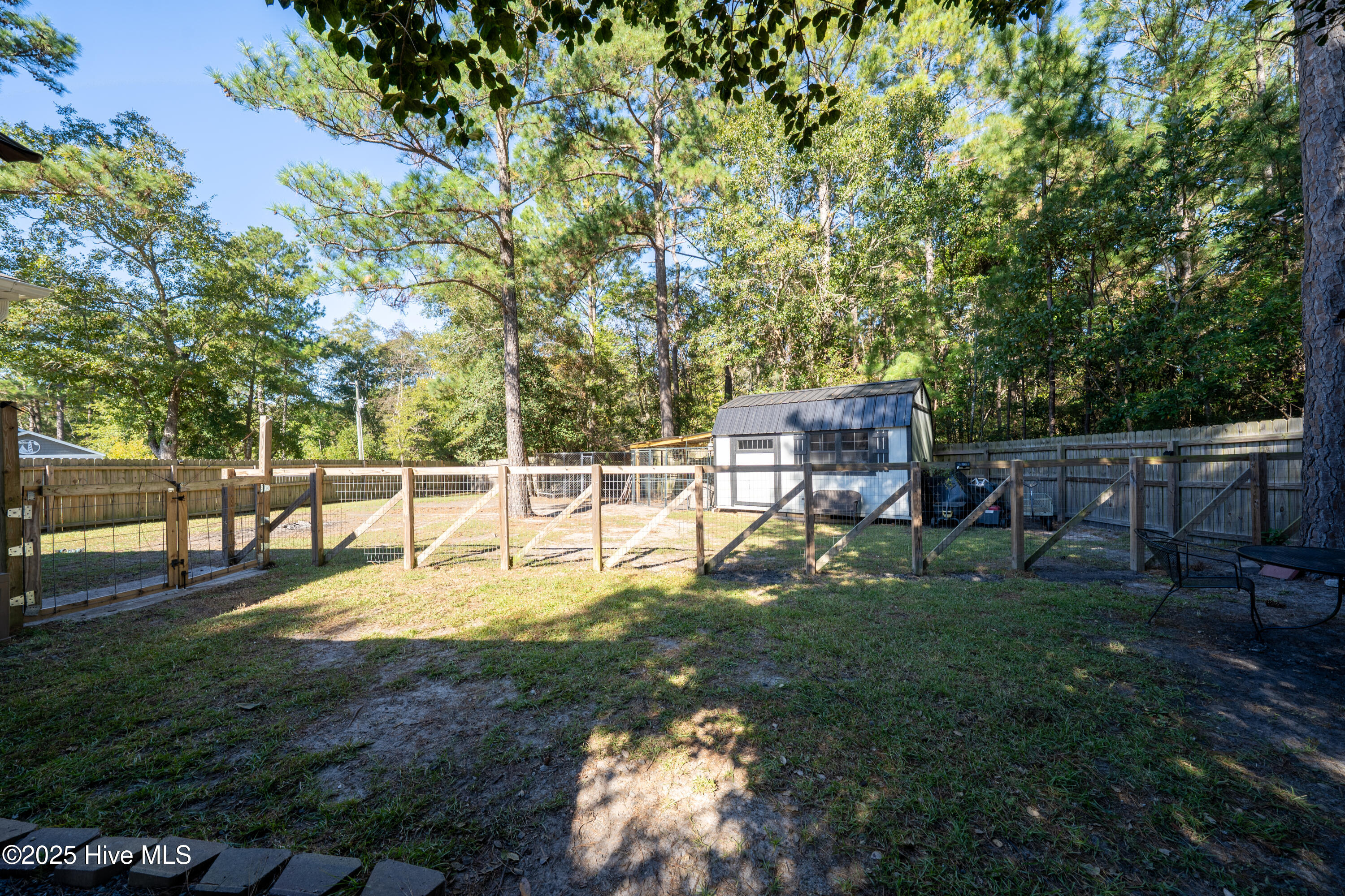 430 Ellis Road Southeast, Unit LOT #55 Bolivia, NC 28422 - Photo 59 of 108 Large shed with metal roof is ideal for storing your lawn equipment & outdoor toys