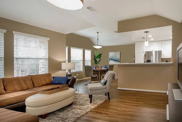 a living room with furniture and a large window