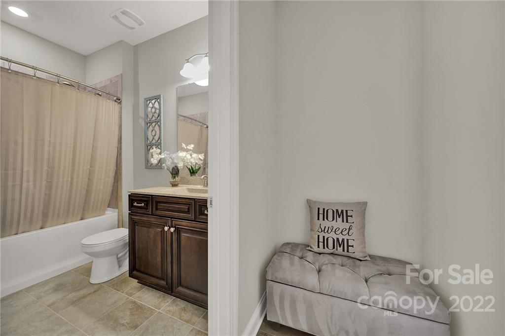 207 Kingsdown Avenue Charlotte, NC 28270 - Photo 18 of 48 a bedroom with a bed and a dresser