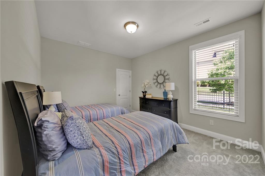 207 Kingsdown Avenue Charlotte, NC 28270 - Photo 19 of 48 a bedroom with a bed and a window