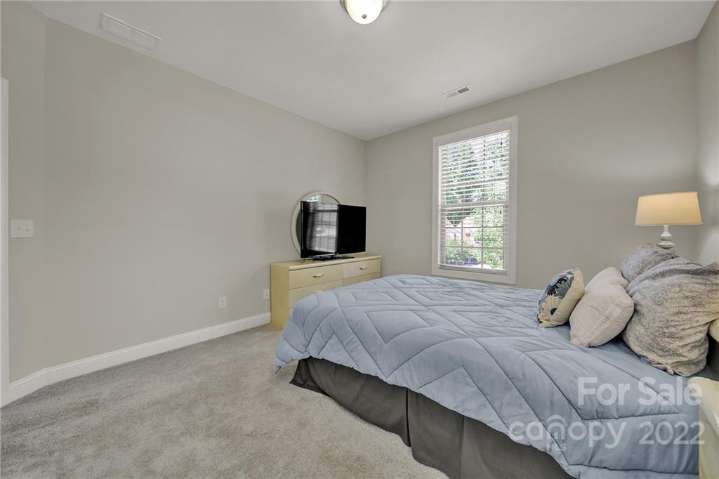 207 Kingsdown Avenue Charlotte, NC 28270 - Photo 27 of 48 a bedroom with a bed and a window