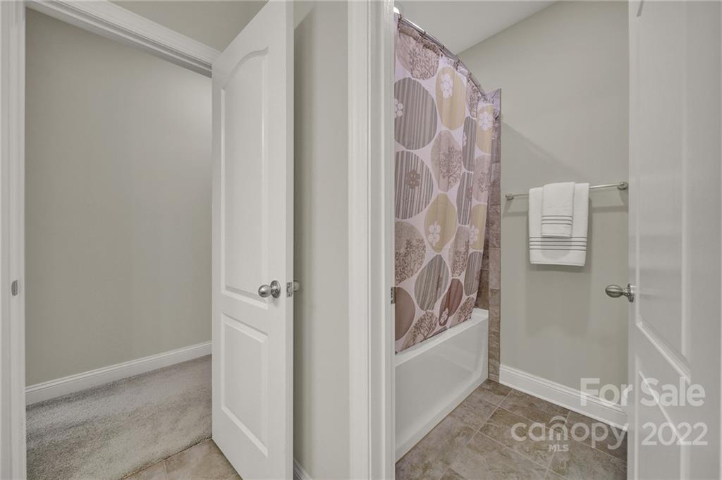 207 Kingsdown Avenue Charlotte, NC 28270 - Photo 29 of 48 a bathroom with a bathtub and shower