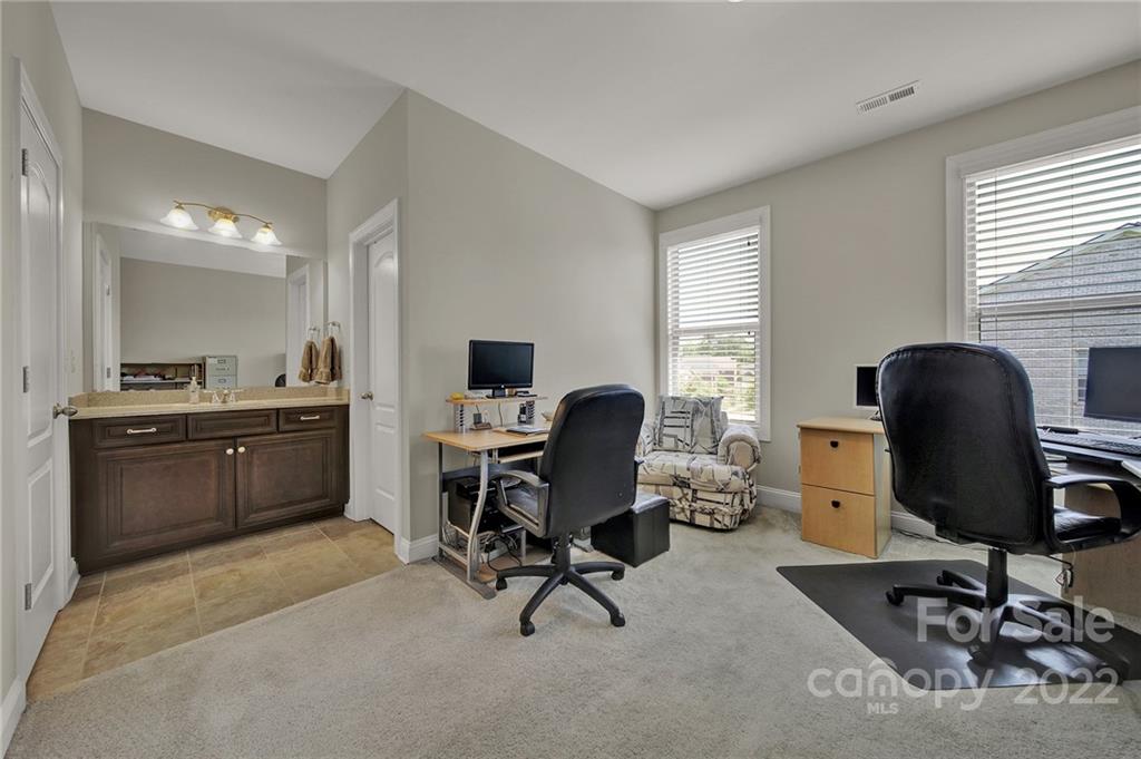 207 Kingsdown Avenue Charlotte, NC 28270 - Photo 30 of 48 a view of a workspace with furniture and a window