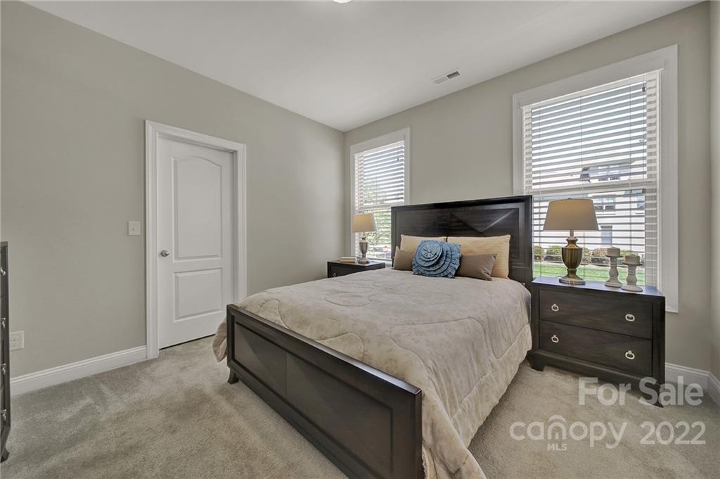 207 Kingsdown Avenue Charlotte, NC 28270 - Photo 32 of 48 a bedroom with a bed and window
