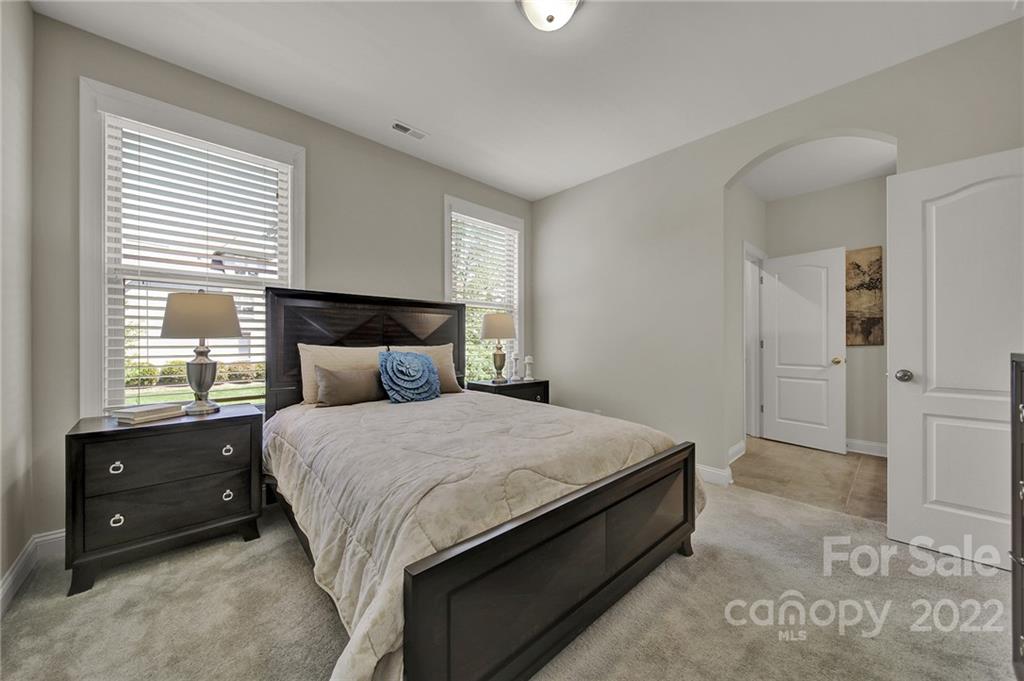 207 Kingsdown Avenue Charlotte, NC 28270 - Photo 33 of 48 a bedroom with a bed and a closet