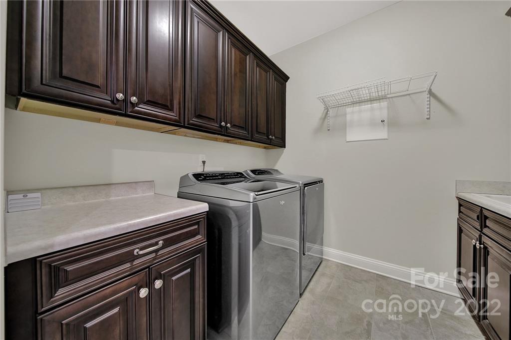 207 Kingsdown Avenue Charlotte, NC 28270 - Photo 35 of 48 a kitchen with granite countertop a stove and a microwave