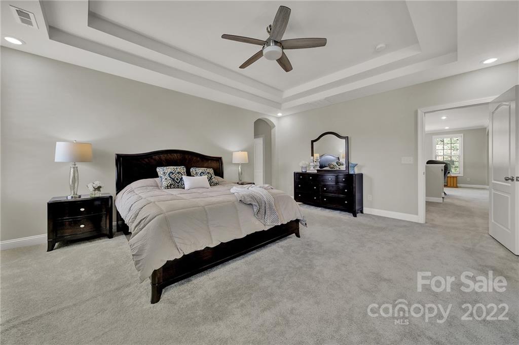207 Kingsdown Avenue Charlotte, NC 28270 - Photo 37 of 48 a bedroom with a bed and dresser