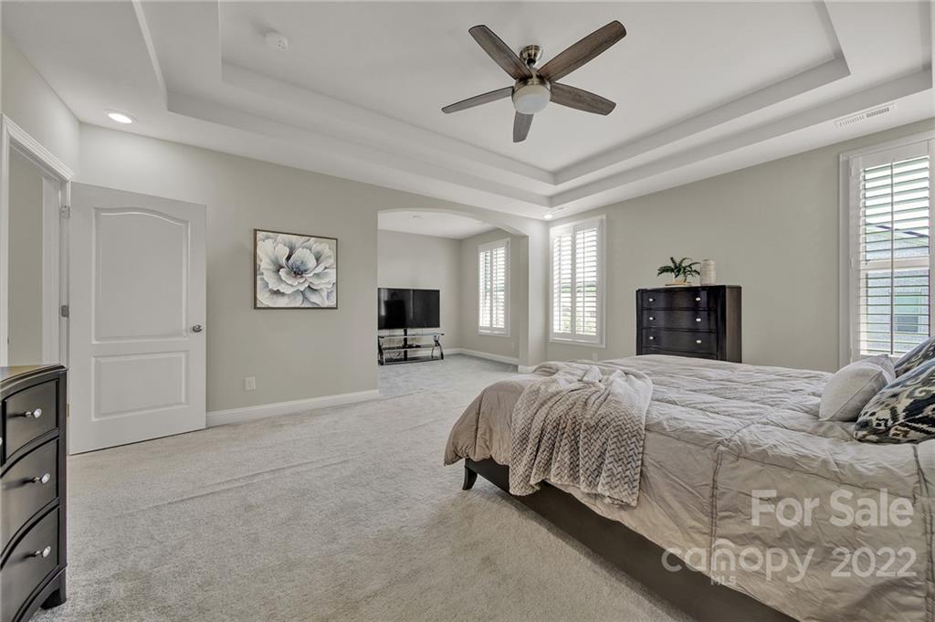 207 Kingsdown Avenue Charlotte, NC 28270 - Photo 38 of 48 a bedroom with a large bed and a tv
