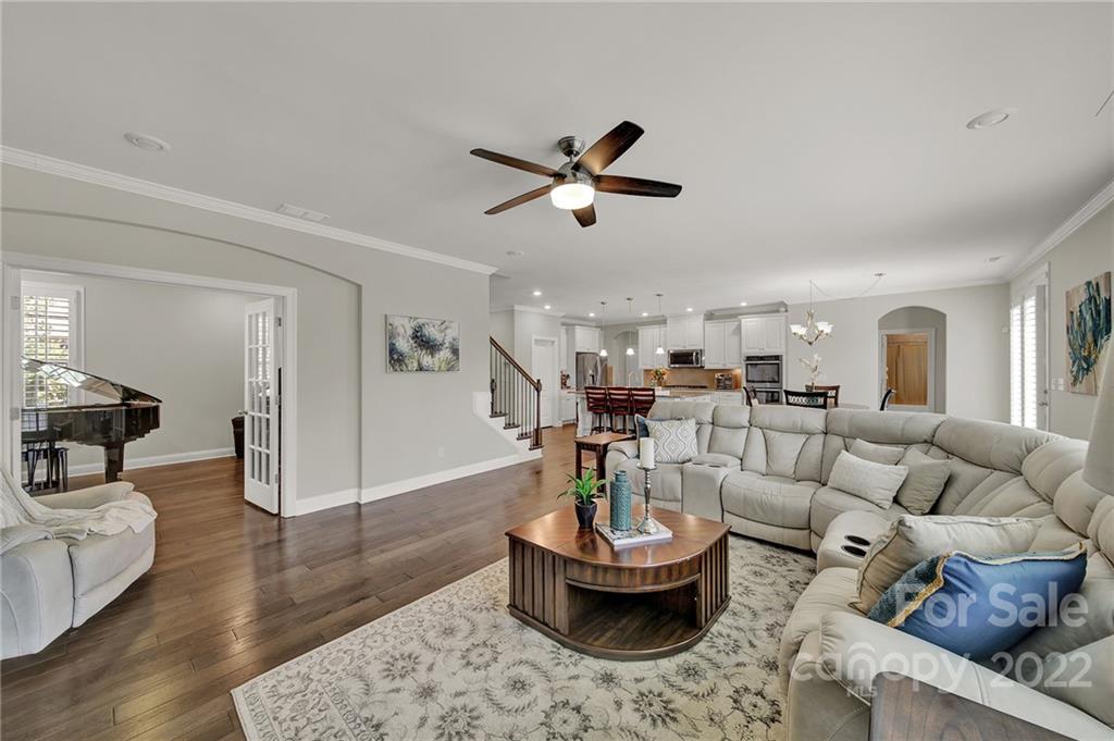 207 Kingsdown Avenue Charlotte, NC 28270 - Photo 8 of 48 a living room with furniture and a chandelier