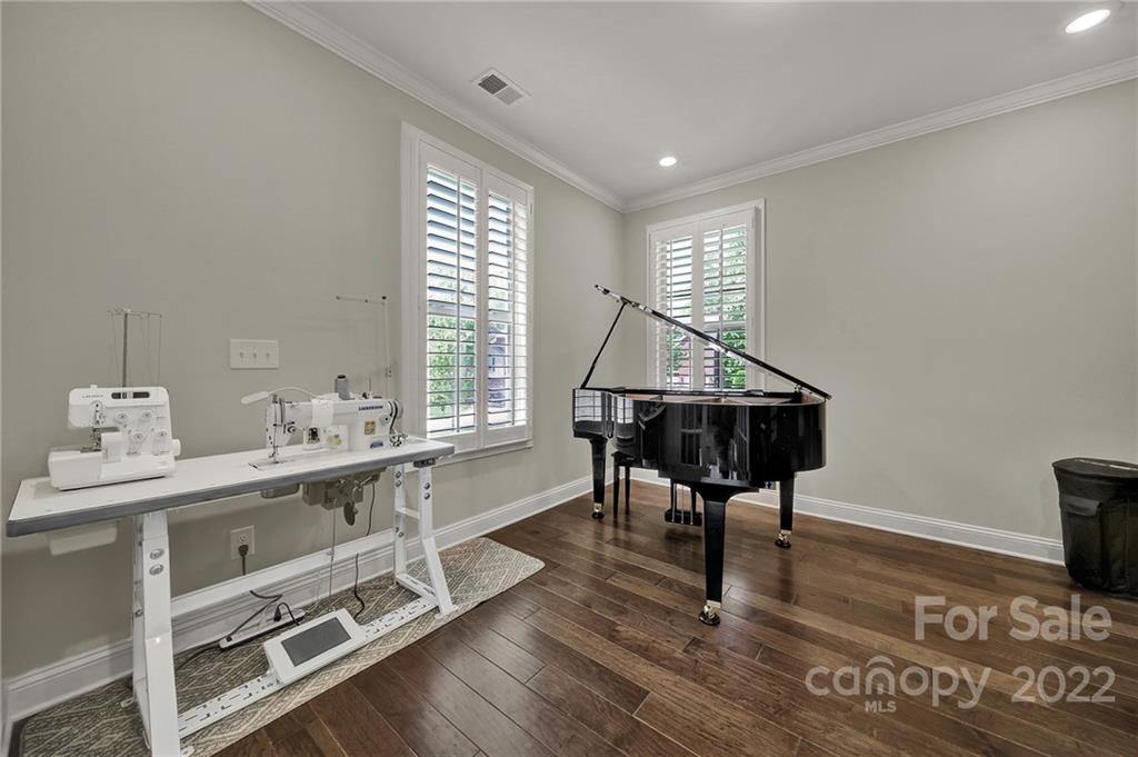 207 Kingsdown Avenue Charlotte, NC 28270 - Photo 9 of 48 a view of a livingroom with furniture window and wooden floor