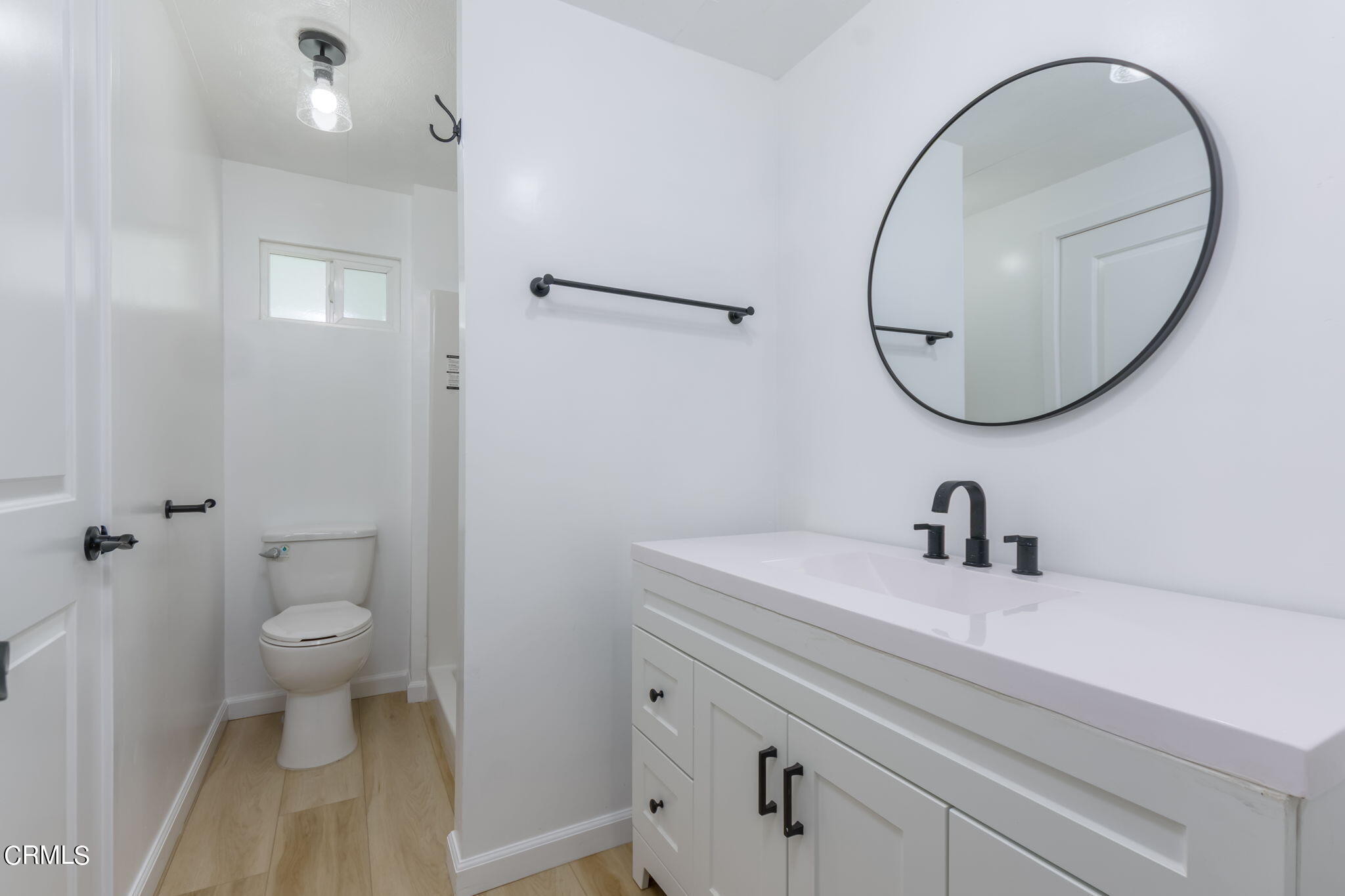 132 Rainbow Drive, Unit 158 Oxnard, CA 93033 - Photo 13 of 21 a bathroom with a sink a toilet and a mirror