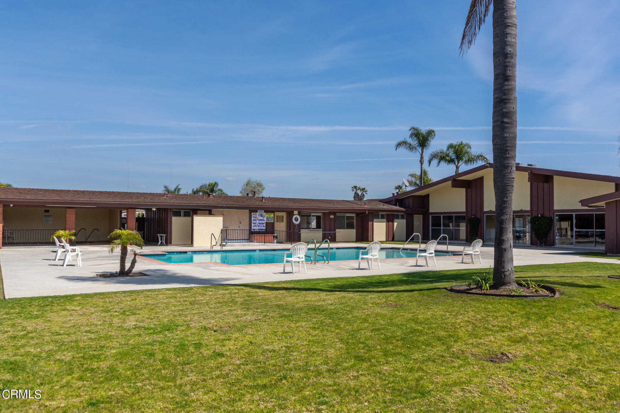 132 Rainbow Drive, Unit 158 Oxnard, CA 93033 - Photo 20 of 21 a front view of building with small garden and plants