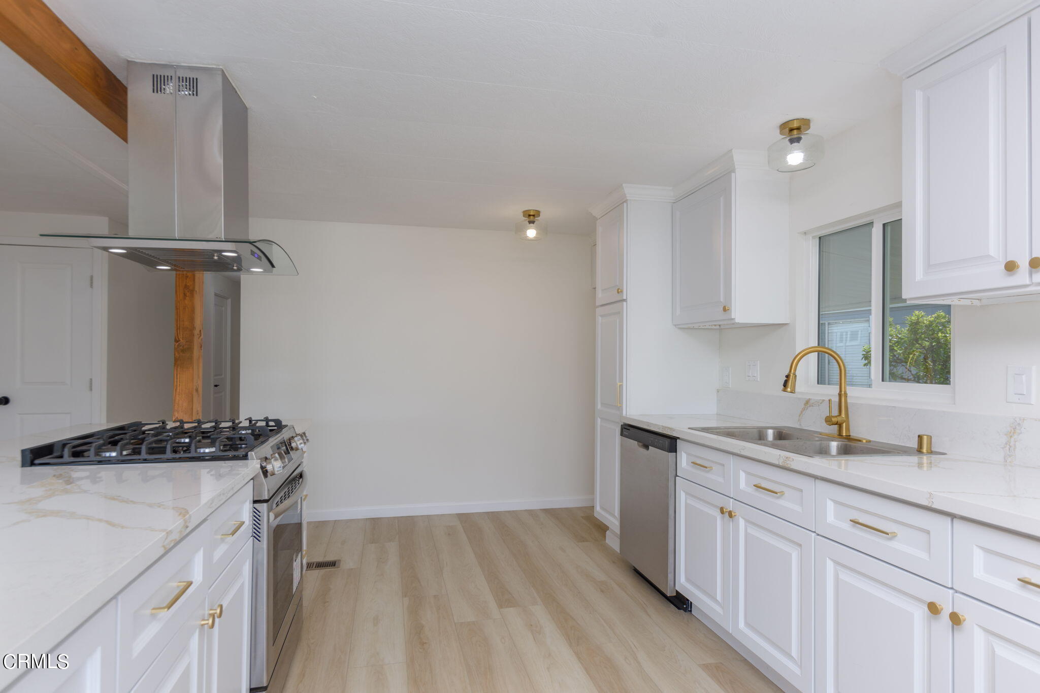 132 Rainbow Drive, Unit 158 Oxnard, CA 93033 - Photo 9 of 21 a kitchen with a sink and cabinets