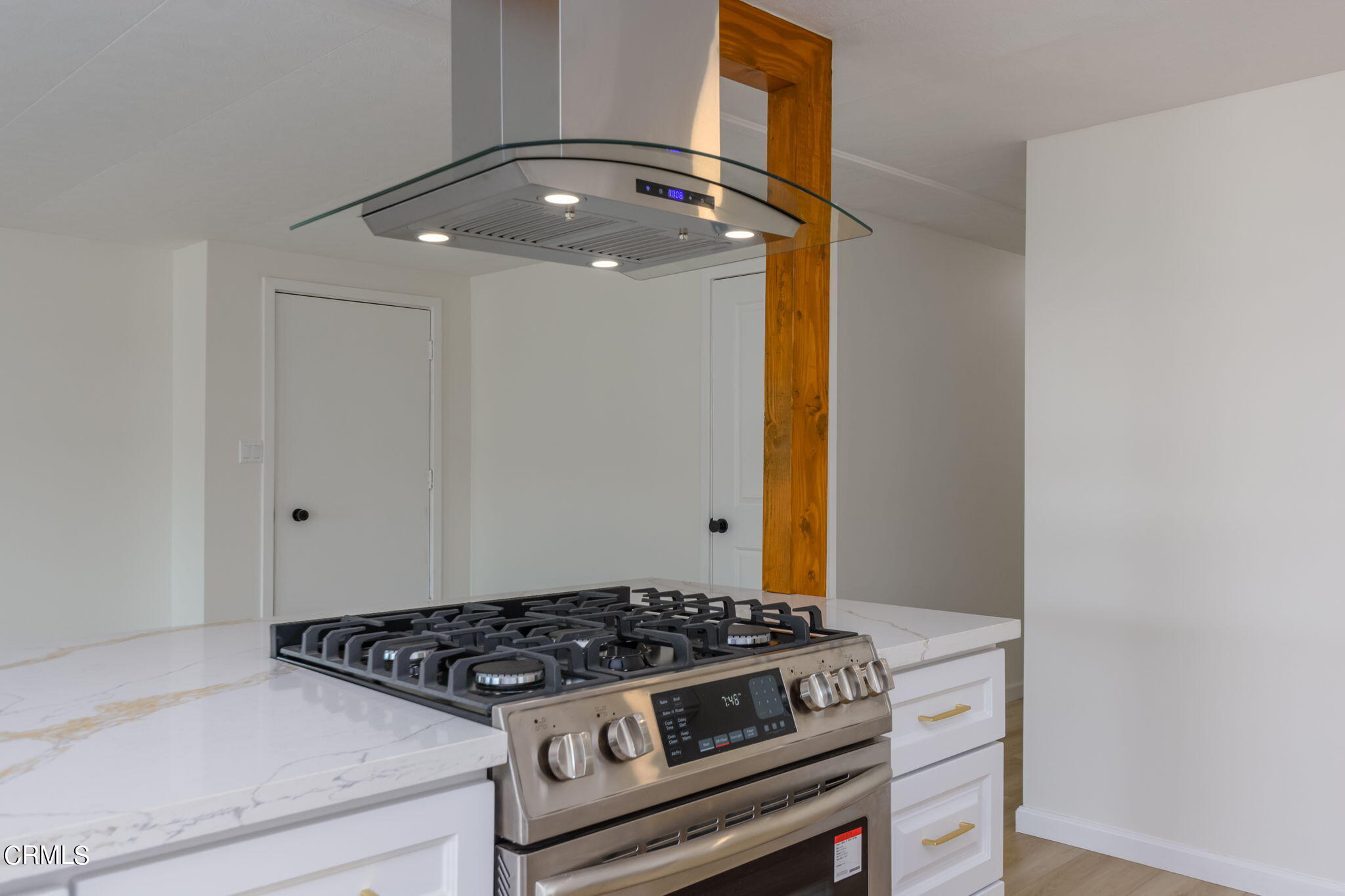132 Rainbow Drive, Unit 158 Oxnard, CA 93033 - Photo 10 of 21 a kitchen with a stove and a granite counter tops