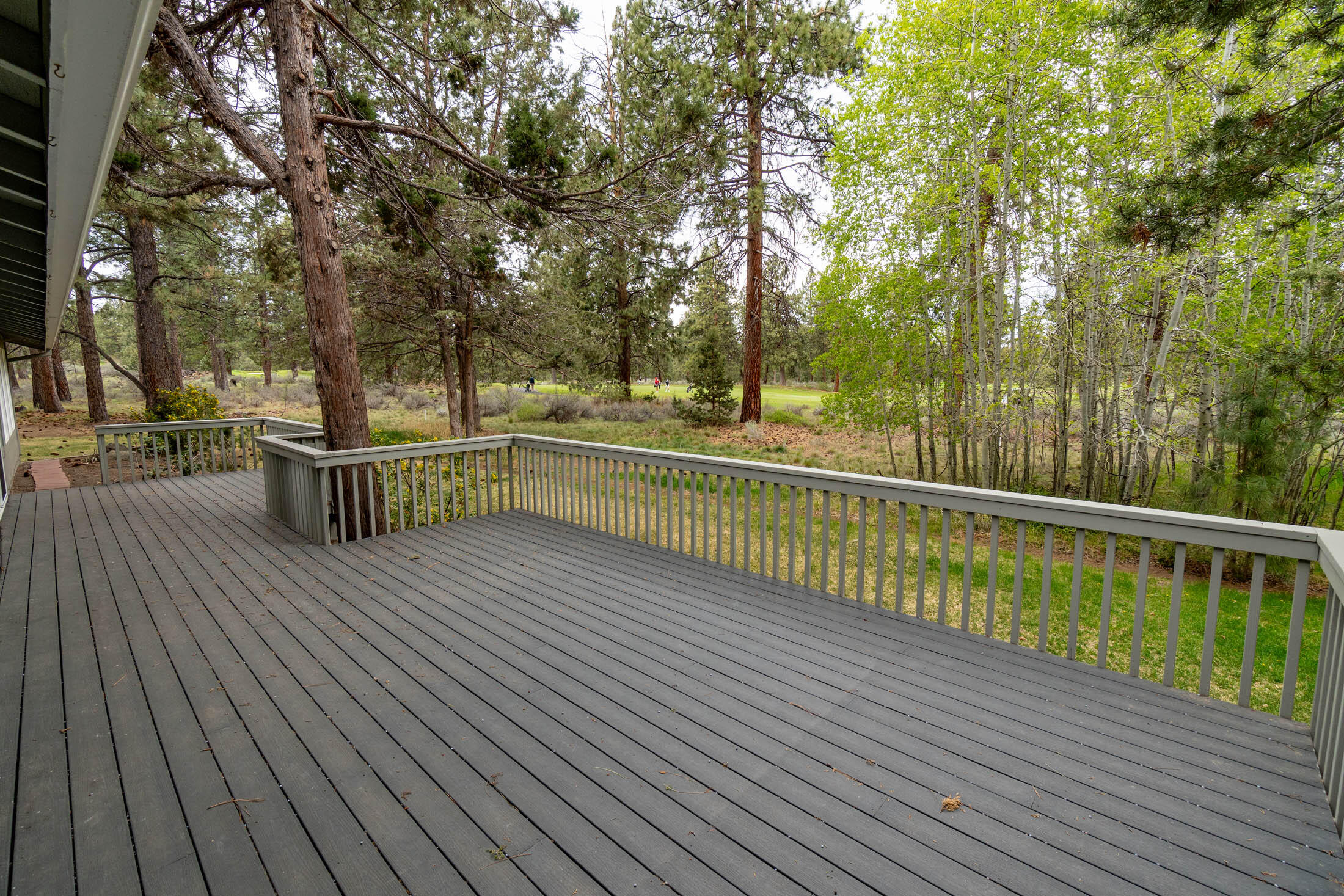 20316 Donkey Sled Road Bend, OR 97702 - Photo 28 of 50 a view of a balcony with wooden floor