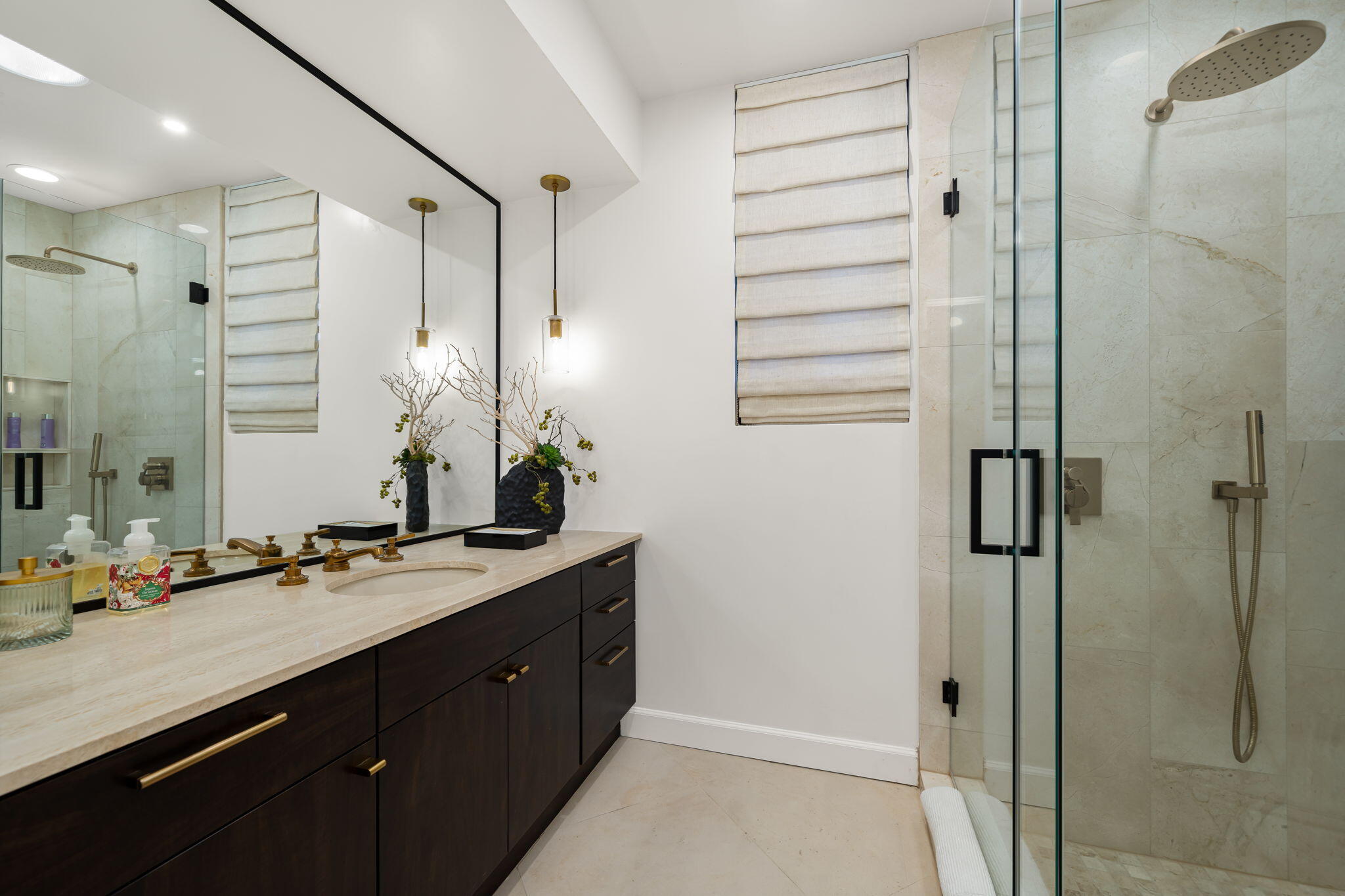 6 Exeter Court Rancho Mirage, CA 92270 - Photo 44 of 54 a bathroom with a double vanity sink a large mirror and shower