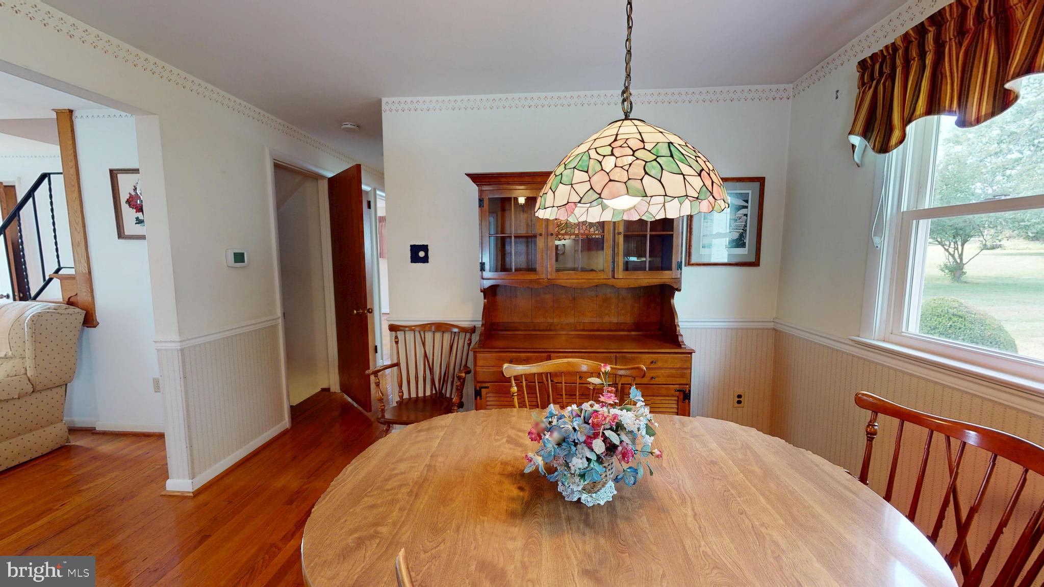1020 Telegraph Road Perkasie, PA 18944 - Photo 10 of 65 a dining room with furniture a potted plant and wooden floor