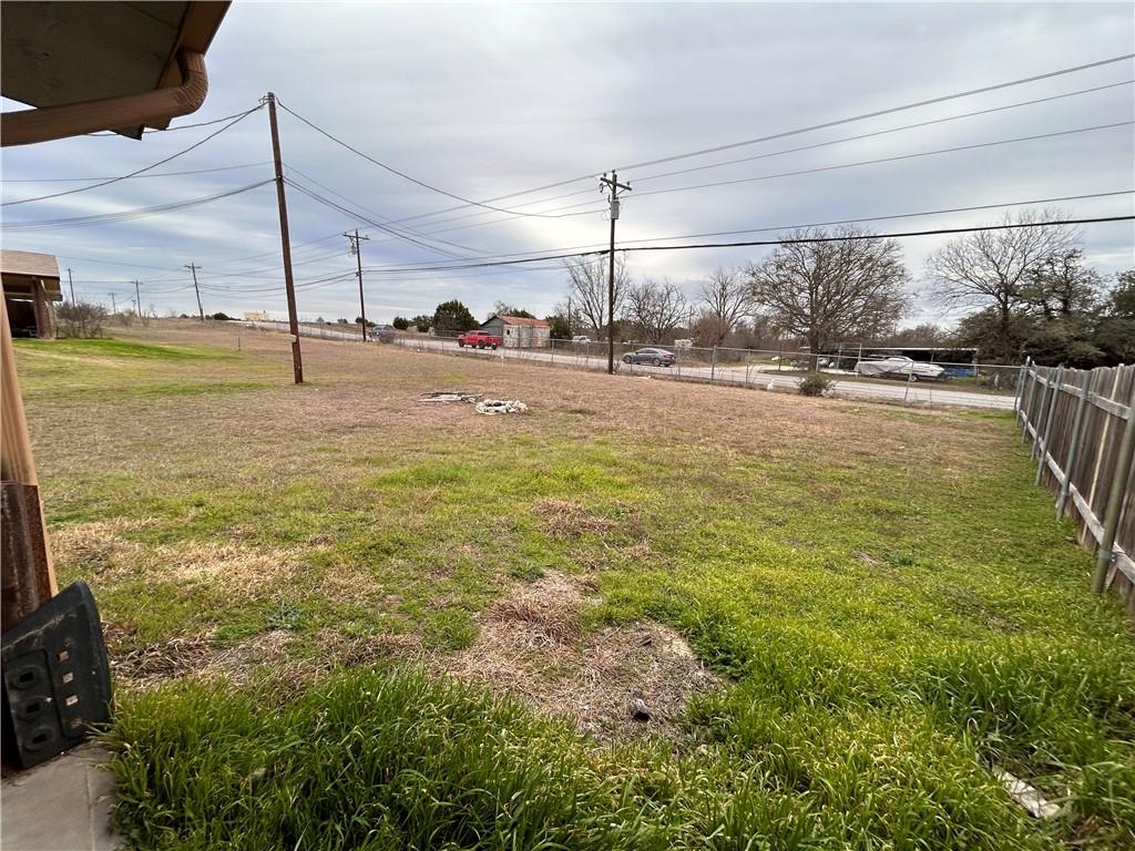 10411 Chaparral Road Killeen, TX 76548 - Photo 5 of 6 A spacious, verdant lot offering ample outdoor potential.