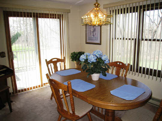 3579 South Bend Road Rockford, IL 61109 - Photo 4 of 10 a view of a dining room with furniture and chandelier
