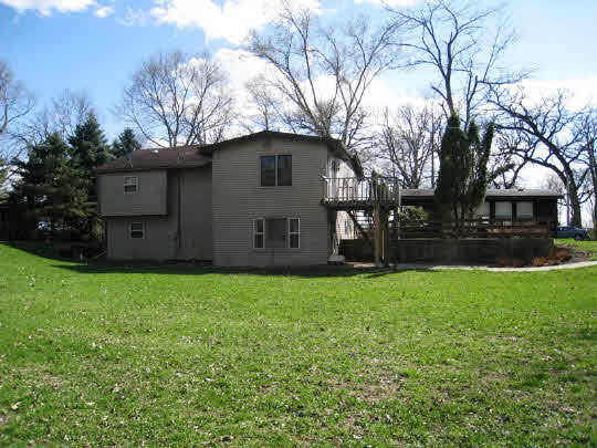 3579 South Bend Road Rockford, IL 61109 - Photo 10 of 10 a view of a backyard with large trees