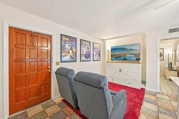 a living room with furniture and a window