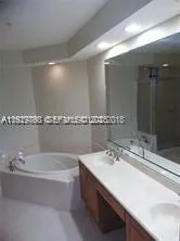 a bathroom with a bathtub and a sink
