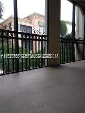 a view of a balcony with city