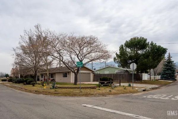 a view of a trees and front view of a house