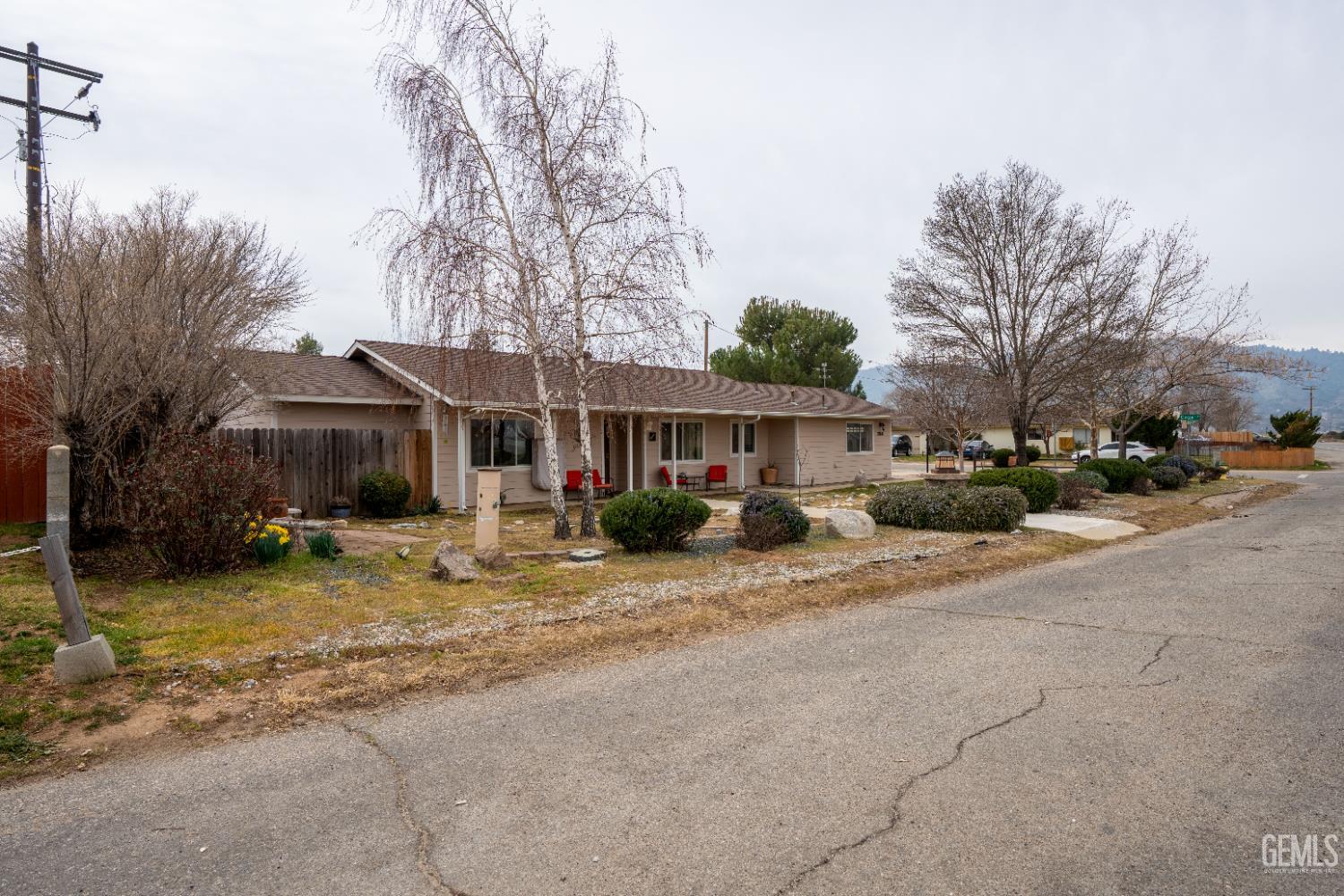 Undisclosed Address Tehachapi, CA 93561 - Photo 4 of 21 a view of a house with a yard and large trees