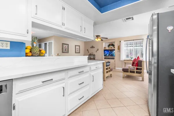 a utility room with cabinets a washer and dryer