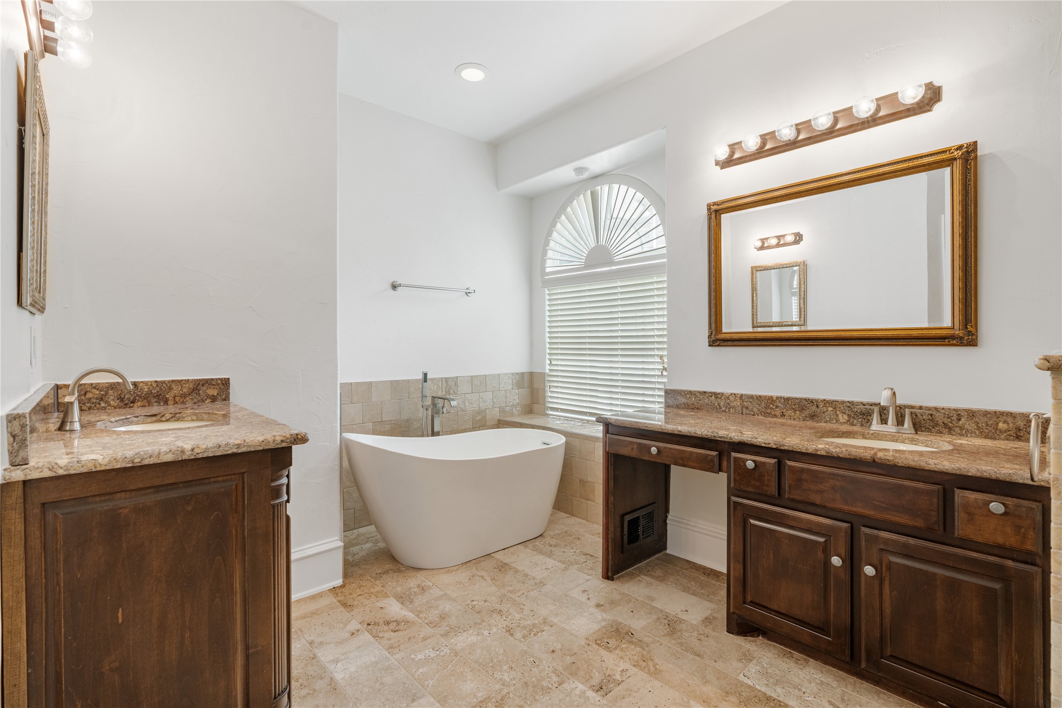 2115 Graystone Ridge Drive Conroe, TX 77304 - Photo 22 of 47 Primary bathroom featuring a relaxing soaking tub and a separate stand-alone shower, complemented by dual vanities with ample counter space and storage, creating a comfortable retreat.