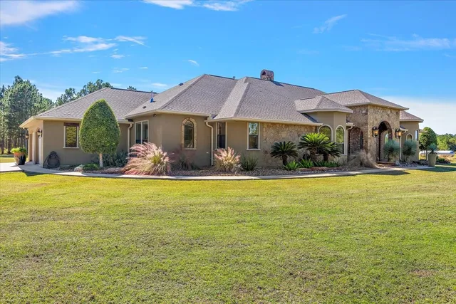 a view of swimming pool with chairs