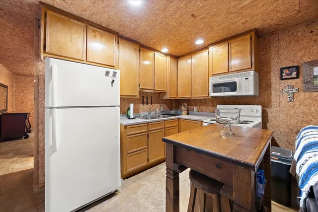 a view of a garage with parked cars