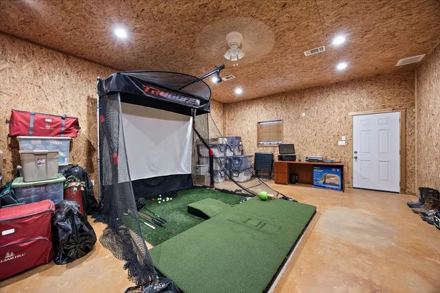 a view of a yard with wooden fence
