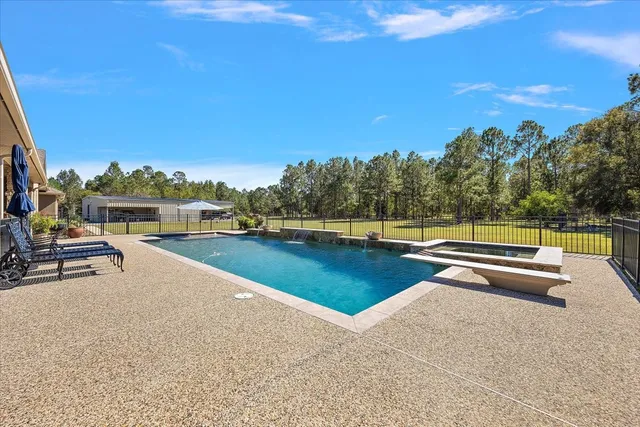 a view of a swimming pool with a patio