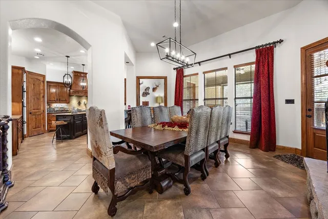 a kitchen with granite countertop cabinets and wooden floor