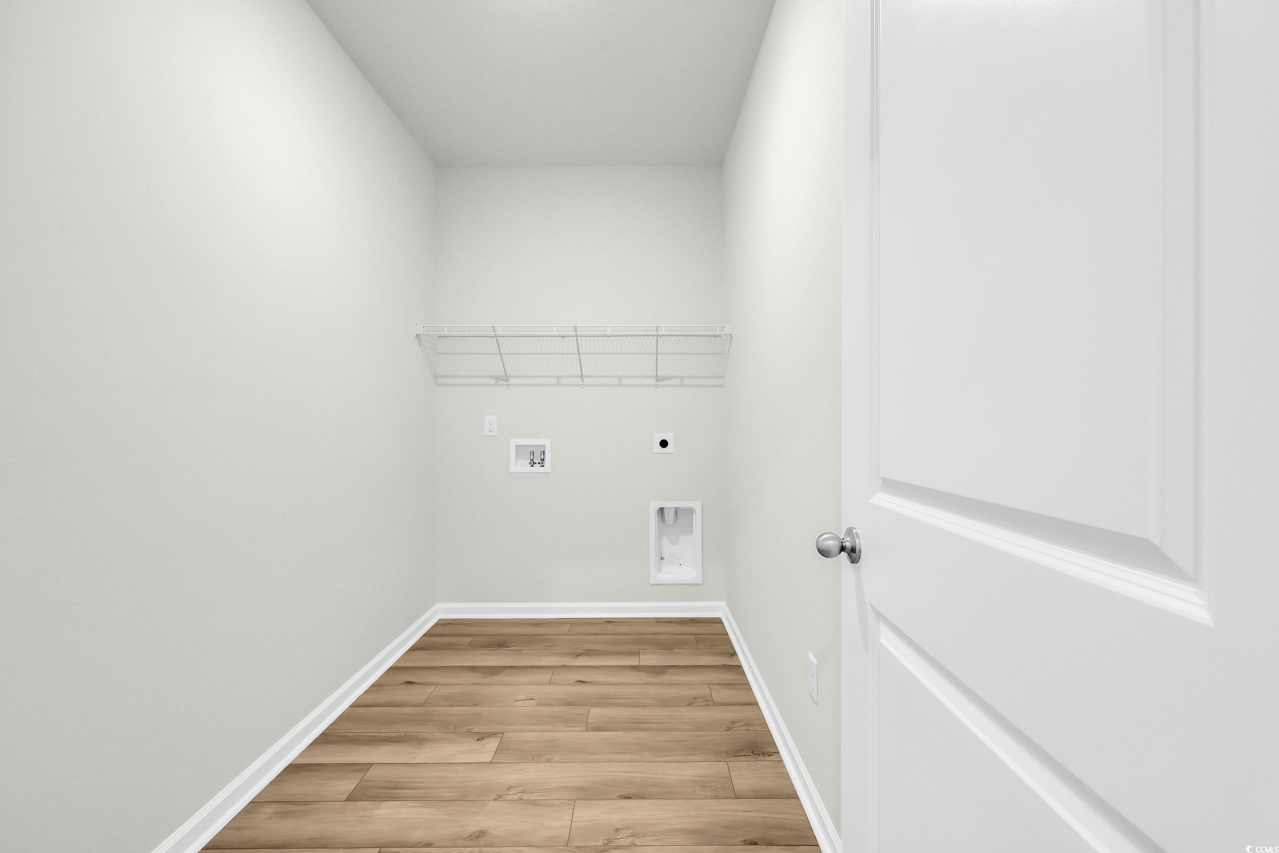 146 River Birch Drive Loris, SC 29569 - Photo 16 of 21 Laundry room featuring hookup for an electric dryer, light wood-type flooring, and hookup for a washing machine