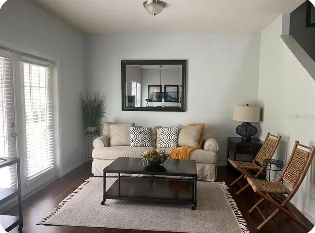 a living room with furniture and a window