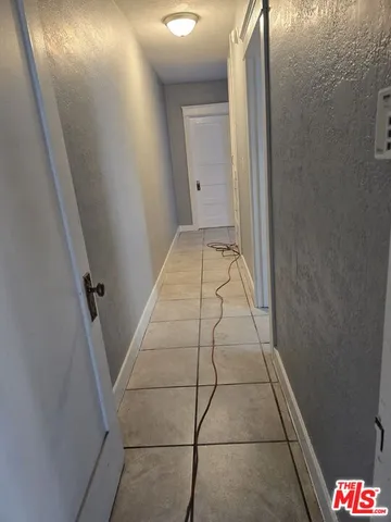 a bathroom with a granite countertop sink and a window