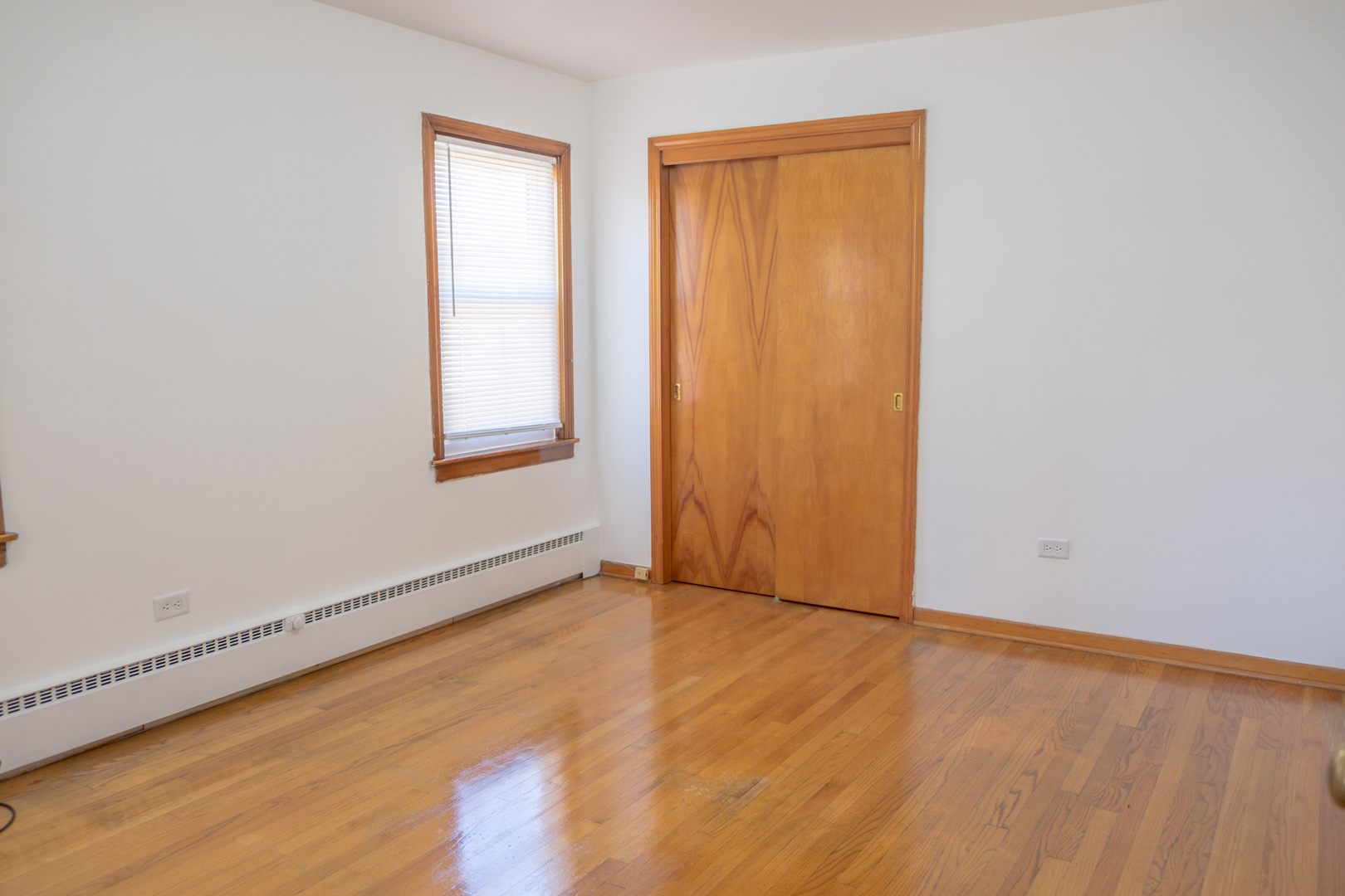 5520 South Pulaski Road, Unit 2 Chicago, IL 60629 - Photo 20 of 44 an empty room with wooden floor and windows