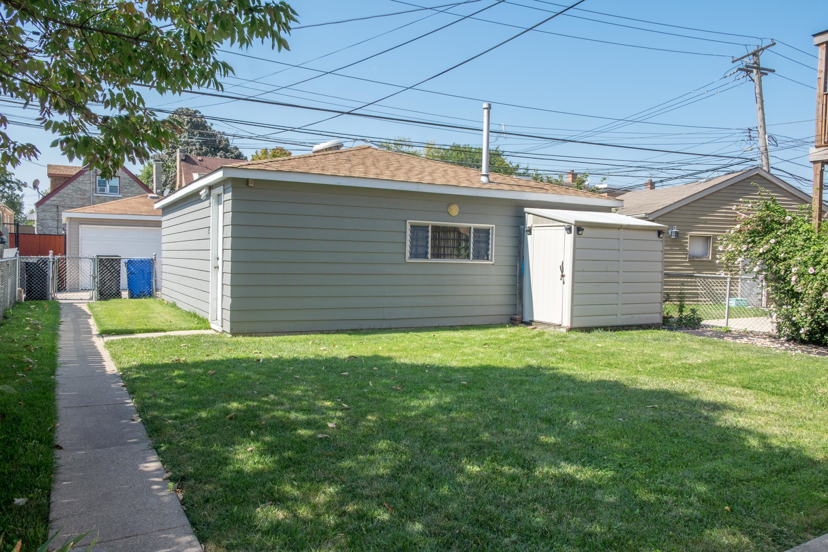 5520 South Pulaski Road, Unit 2 Chicago, IL 60629 - Photo 36 of 44 a view of a house with a backyard