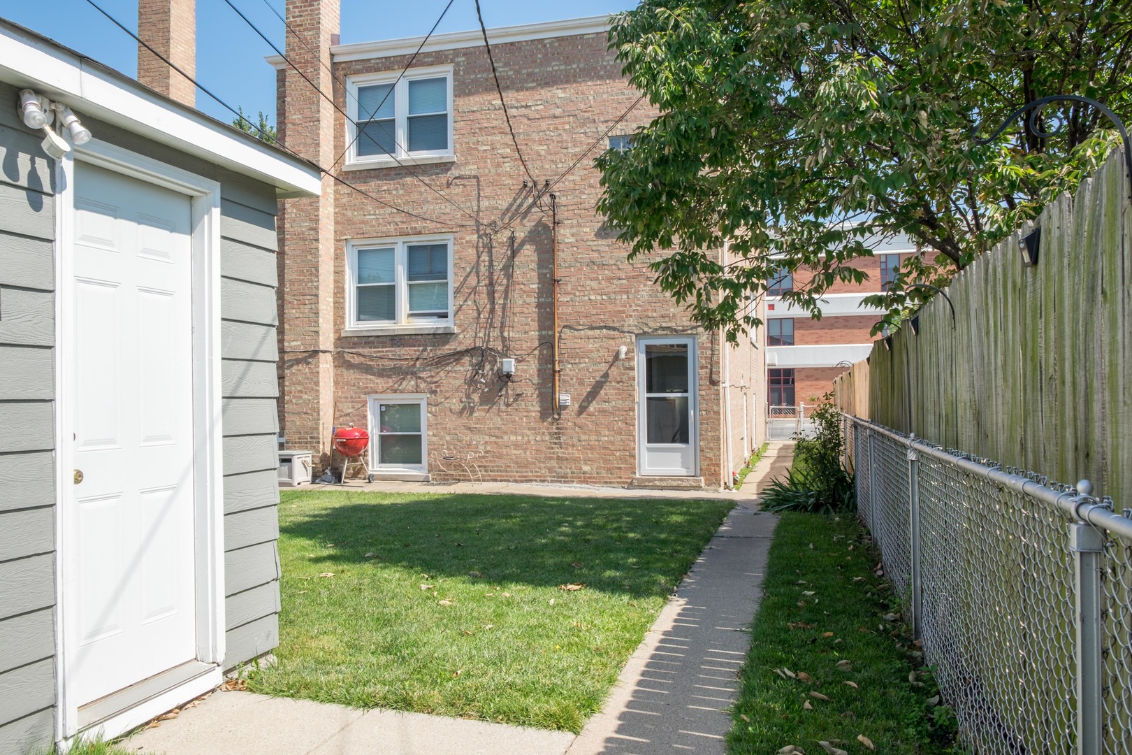 5520 South Pulaski Road, Unit 2 Chicago, IL 60629 - Photo 38 of 44 a view of a house with a yard