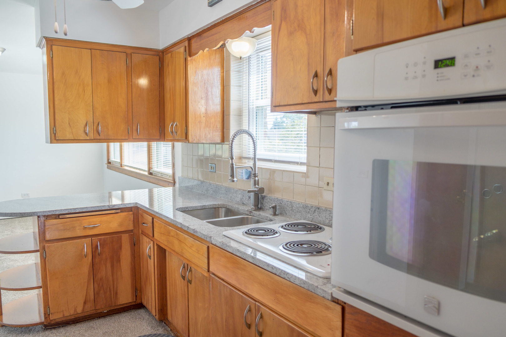 5520 South Pulaski Road, Unit 2 Chicago, IL 60629 - Photo 5 of 44 a kitchen with a sink stove and cabinets