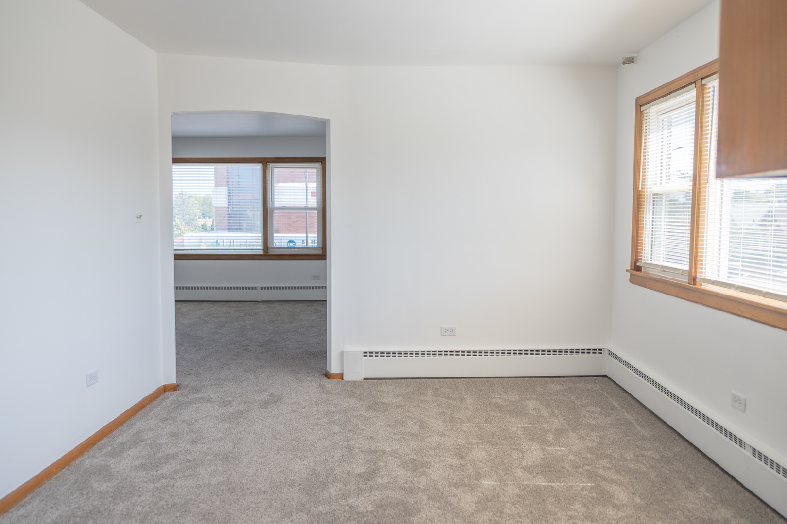 5520 South Pulaski Road, Unit 2 Chicago, IL 60629 - Photo 9 of 44 an empty room with a empty space and windows