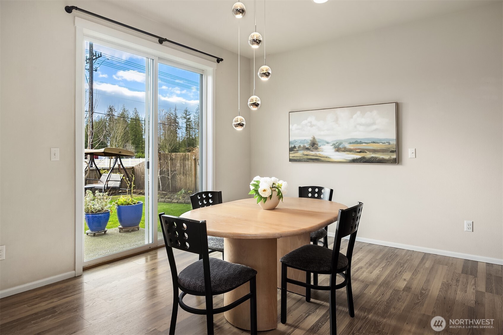 17604 Quartz Street Granite Falls, WA 98252 - Photo 11 of 40 a view of a dining room with furniture one side kitchen view and wooden floor