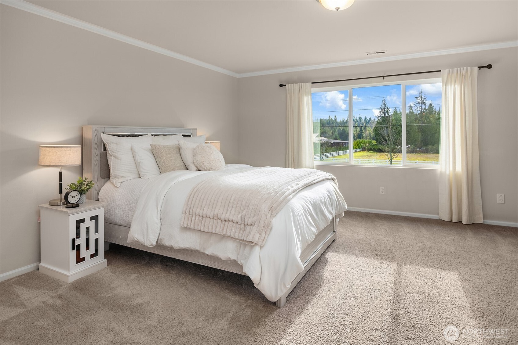 17604 Quartz Street Granite Falls, WA 98252 - Photo 16 of 40 a bedroom with a bed table and a large window