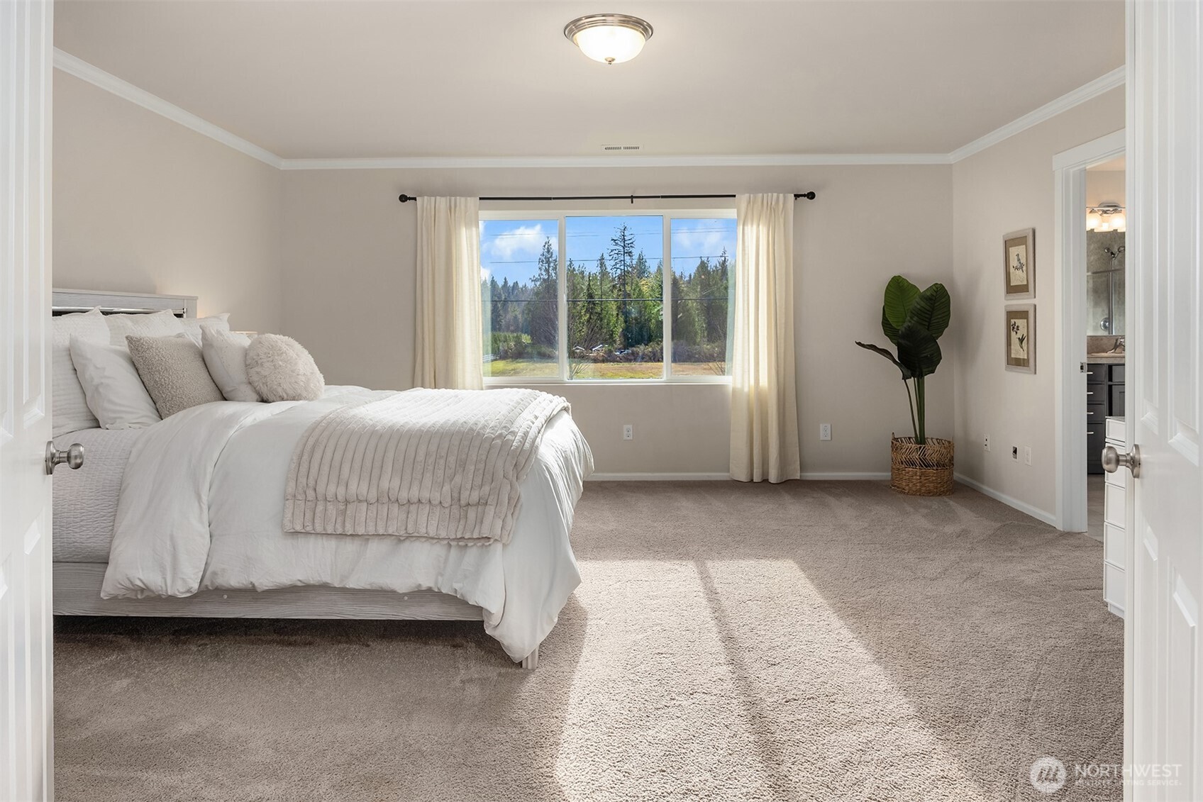 17604 Quartz Street Granite Falls, WA 98252 - Photo 17 of 40 a bedroom with a bed and a large window